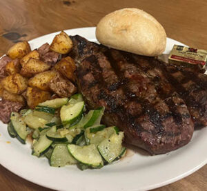 Steller 181 steak, potatoes, veggies and bread