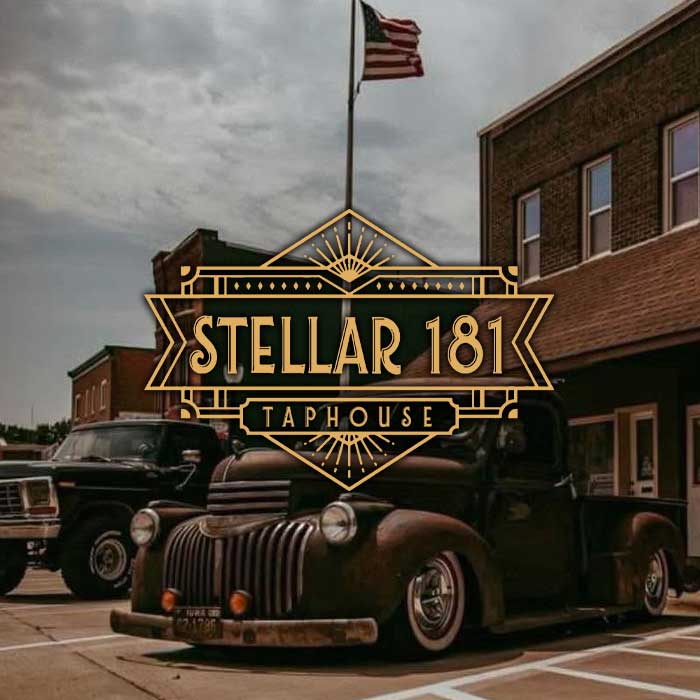Stellar 181 Taphouse logo over a vintage truck parked in front of a building.